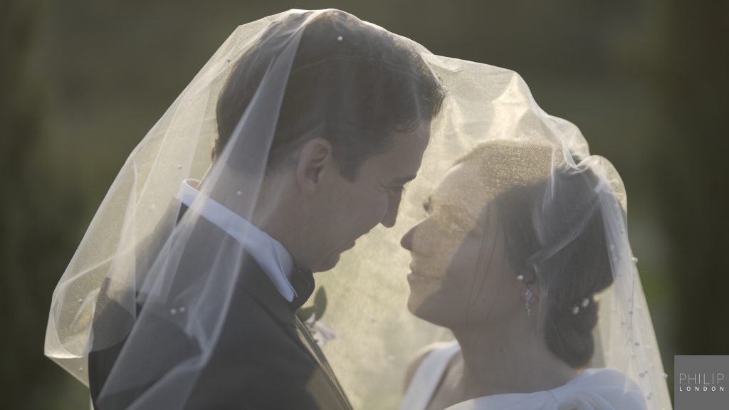 Veil over couple on their wedding day