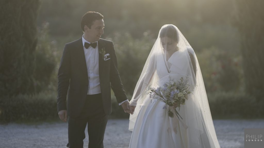 Couple walking in sunset on their wedding day photo