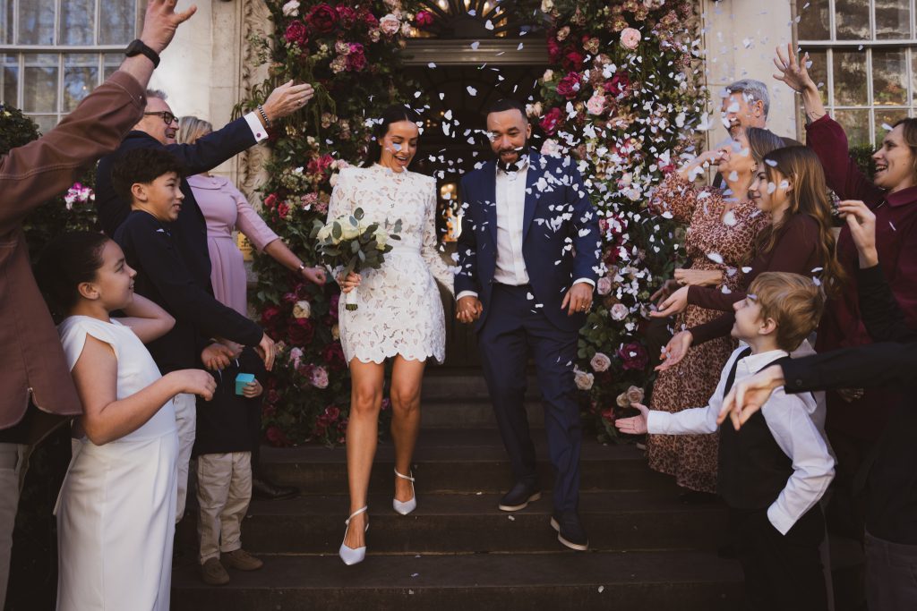 Wedding photo on the steps of Chelsea Old Town Hall
